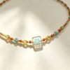 ELA BOUTIQUE |AMBER SQUARE SUNBURST NECKLACR